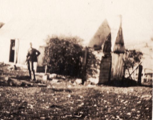 Man standing in front of slab house