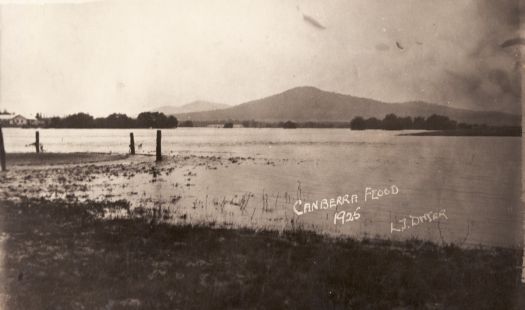 Canberra Golf Links, flooded. A building is visible on slightly higher ground to the left.