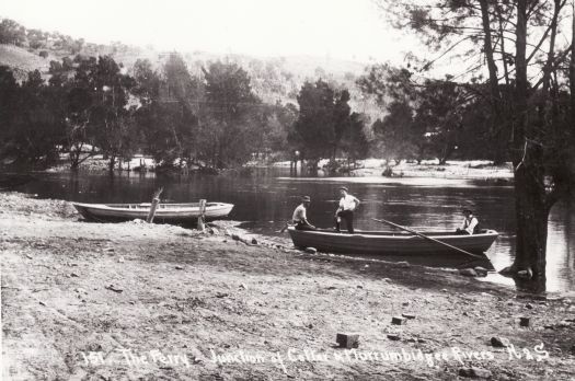 The ferry, junction of Cotter and Murrumbidgee Rivers, with three men in a boat.