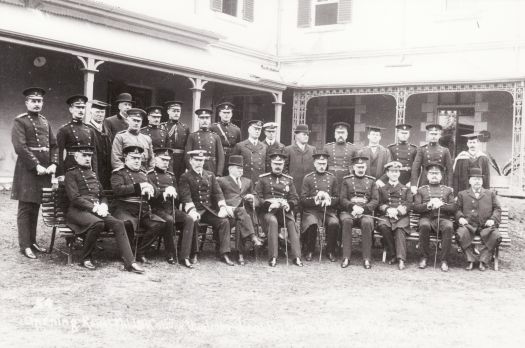 The official opening of the Royal Military College, Duntroon in June 1911. Group photograph with staff and officers in front of Duntroon House.