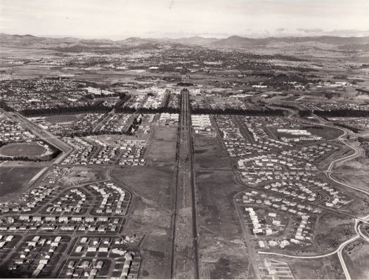 Aerial view of North Canberra looking down Northbourne Avenue. Predates the construction of the Owen, Lyneham and Dickson flats and the ABC studios.
