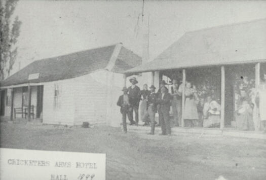 A group of patrons outside the Cricketer's Arms Hotel, Hall