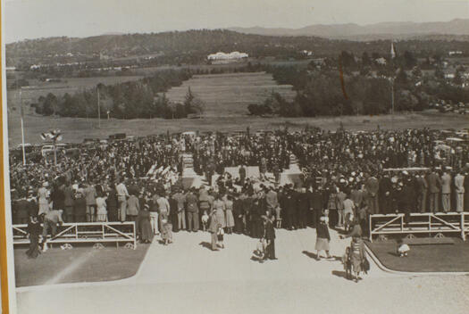 Anzac Day ceremony on 25 April 1952, in front of the Australian War Memorial, looking towards Parliament House. Photograph pre-dates Anzac Parade (opened in 1965) though trees line the route of the planned road. Nor are houses visible on the Campbell side of Anzac Parade.