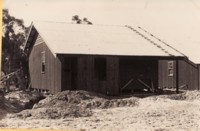 Rear view of a portable cottage at Acton.