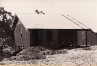 Rear view of portable cottages at Acton.