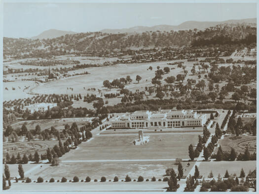 Aerial view of Parliament House looking towards Forrest and Red Hill. The spire of St. Andrews is in the distance and East Block in the foreground.