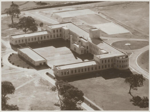 Aerial view of Canberra High School with Beauchamp House and Acton Hotel in the background.