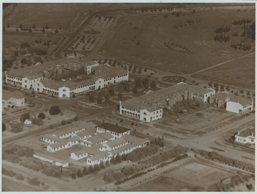 Aerial view of Civic c1944. Shows Civic Centre with the Sydney and Melbourne Buildings, Hotel Civic and the Canberra Services Club.