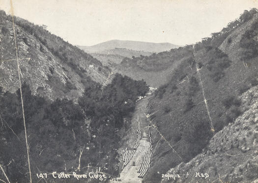 Cotter River gorge showing pipes on the ground before the construction of the Cotter Dam