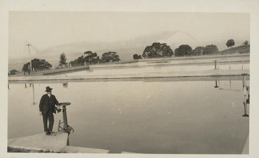 Man standing at a reservoir