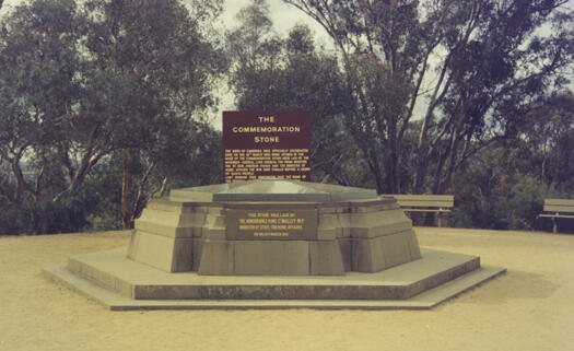 Commemoration stone in the bush on Capitol Hill and signage