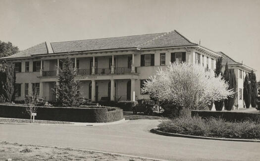 Beauchamp House, now Ian Potter House, in Marcus Clarke Street, Acton. Photo shows a front view of Beauchamp House with 3 cars parked in the front of the building.