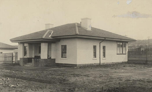 Cottages in Forrest showing a front view with no lawn, only dirt.