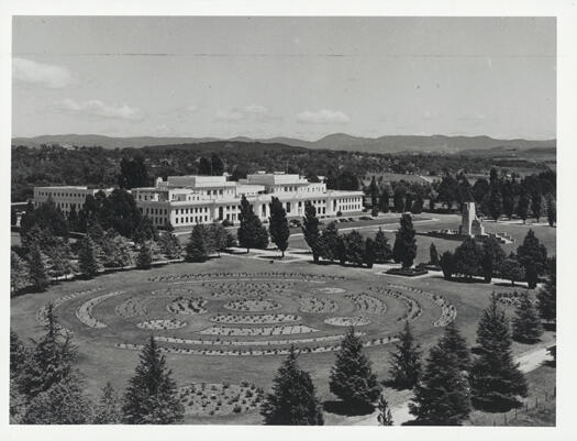 Aerial view of Parliament House showing the Rose Garden on the western side.