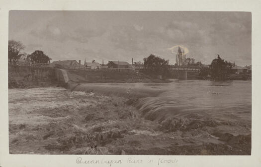 Water pouring over the weir on the Queanbeyan River when the river was in flood.