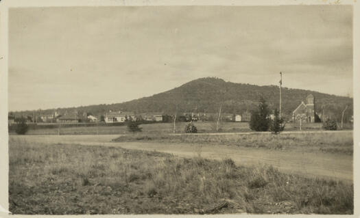 Shows the Uniting Church in Reid at right, on the corner of Ballumbir and Boolee Streets.