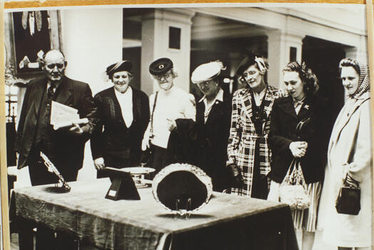 Thora Shoard and Allison Ryan (nee Marks) admiring the gift from Australia to Princess Elizabeth and Prince Phillip on their wedding.