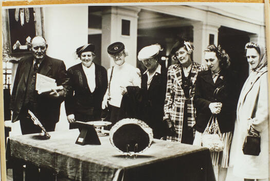 Australian Government's wedding presents to Princess Elizabeth and Prince Phillip. Left to Right: Rolly James MP, unknown, unknown, unknown, unknown, Thora Shoard, Allison Ryan (nee Marks)