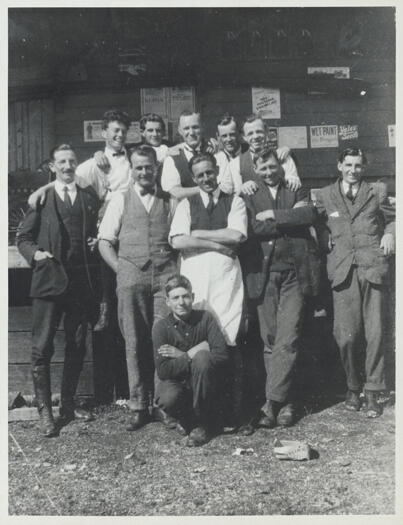 Canberra Co-op Store staff. 

Back row: M. Campbell, Eugene De Smet, J Gallagher, Dave Pegram,  Keith Carnall. 

Front row: E. Paynting, Jack Esmond, Bob Shannon, Phil Corkhill, Norman Reid.

Kneeling: Jack Cotterill
