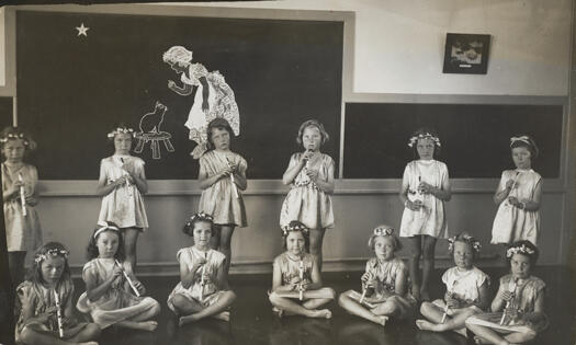 Telopea Park School primary class students during a school play. Some of the students have flutes.