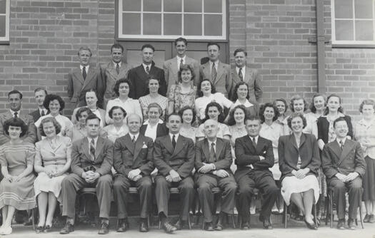 Telopea Park School staff and teachers taken with the school in the background