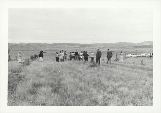 CDHS excursion to Lanyon and Tuggeranong showing a group of people in a paddock.