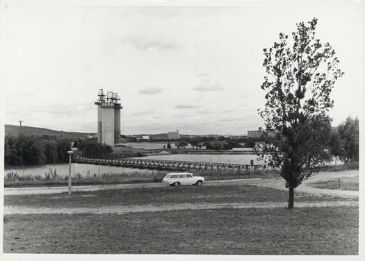 Carillon, Aspen Island from Kings Park. A car is travelling west along Wendouree Drive.