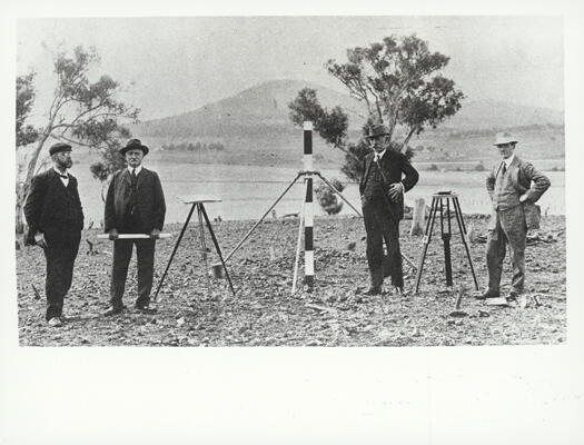 Board of Assessors for the Federal Capital Design Committee on Camp Hill. Left to right: J.A. Smith, J. Kirkpatrick, J.M. Coane, C. Inglis-Clark (Secretary). Mt. Ainslie is in the background.