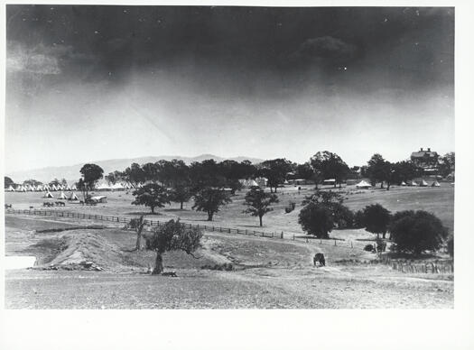 Yarralumla camp showing tents in the background with Government House on the right.