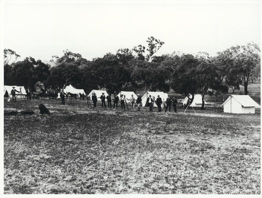 Contour survey camp near Camp Hill showing fourteen men with theodylites and tents in the background