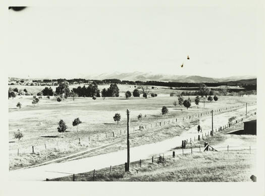 View south over Corkhill's dairy and the Molonglo River to the snow covered Brindabella Ranges.