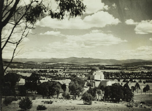 View from Mt. Ainslie over the Australian War Memorial and the Molonglo river to the Brindabella Range. St. John's church spire is visible.