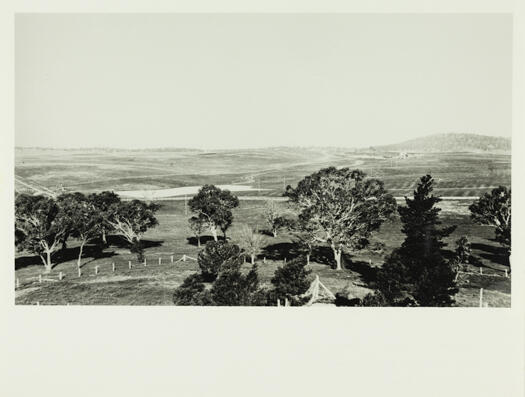 View of top of Government House. Mt Ainslie is in the distance and St. John's Church is also visible.