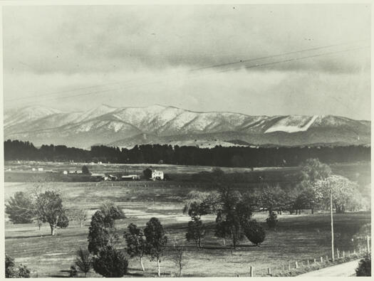 Corkhill's Dairy showing snow on the hills in the background. Also referred to as 'Riverview'.