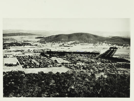 A view of Canberra from Mt. Ainslie showing the Hotel Ainslie, Ainslie Primary School, Haig Park and with Black Mountain at the rear.