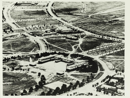Aerial view shows Telopea Park School, Brassey House, Phillip Park, Hotel Wellington and Sydney Avenue.