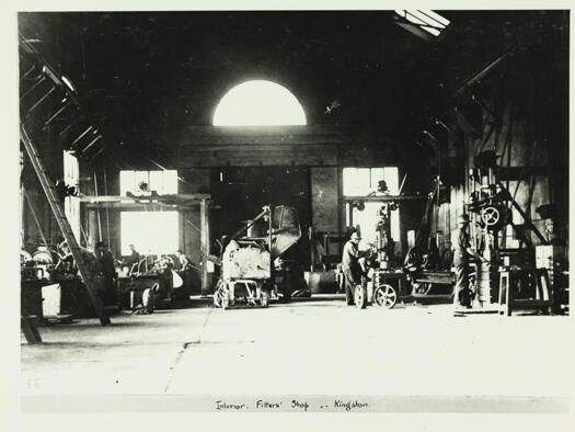 Interior of the Fitters shop, Kingston showing unidentified six men working on machines.