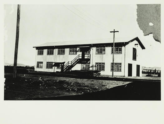 Shows the two storey building in Kingston used as a joinery shop