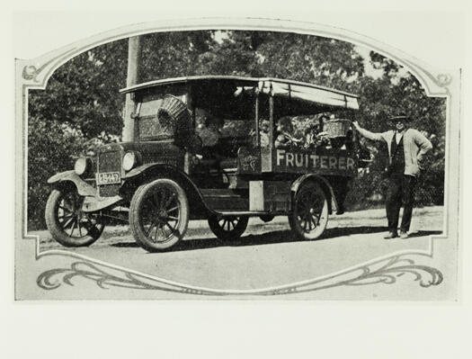 Fruit and vegetable deliveries showing the fruiterer standing beside his vehicle