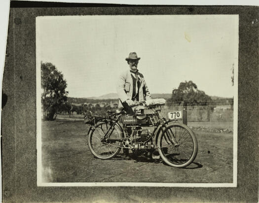 Charles Scrivener and his motorised bicycle.