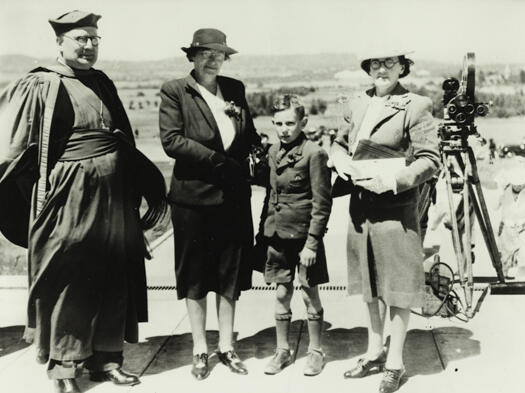 Bishop Burgmann, Mrs Robinson and son and Mrs Burgmann standing on the steps of the War Memorial at its opening.