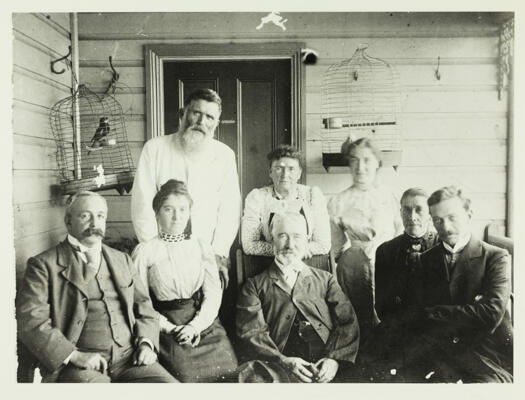 Sullivan family showing four men and three women on the verandah of a house, probably Springbank homestead.