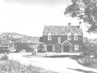 A front view of the two storey house at Melrose Valley, Tuggeranong. An early model car is on the left.