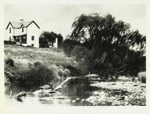 Side view of Corkhill's Dairy on Molonglo River. Demolished to make way for Lake Burley Griffin. Site near Yarralumla Bay.