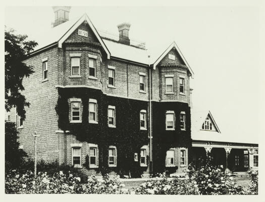A front view of Government House, Yarralumla before renovations in 1926. The date 1891 can be seen on the front of the house - the date the extensions were constructed by Frederick Campbell.