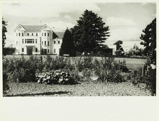 Side view of Government House, Yarralumla. Shows well kept lawns in comparison to photos from earlier times.