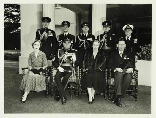 Government House, Yarralumla group photo.

Back row: Lt. Col. Gilleat, Squadron Leader Blackwell, Lt. Col. Connor, Captain Waller-Brown, Lieutenant J.M. Kelly.

Seated: Henrietta Montague, Sir William Slim, Lady Slim, Murray Tyrrell (Official Secretary).