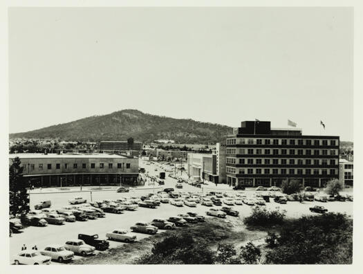 Petrie Street and London Circuit, Civic showing Leggett Chemist on the left and Petrie House and the MLC Building on the right hand side of Petrie Street.