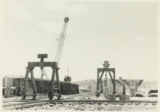 Kings Avenue Bridge under construction. Shows mobile hydraulic jacks for lifting and moving pre-stressed concrete beams.