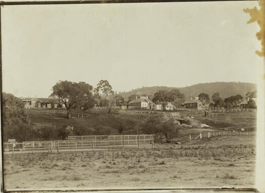 Bachelor's Quarters, survey department officer's homes with tennis court on the flat. Lime kiln at lower right.